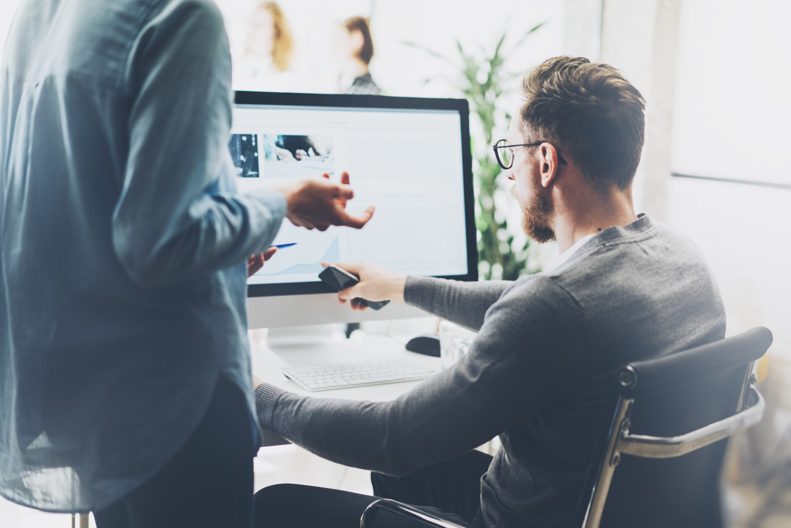 man reviewing credential document on computer
