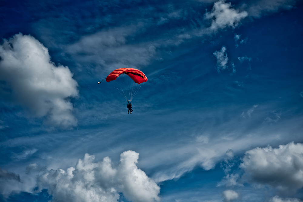 red parachute in sky