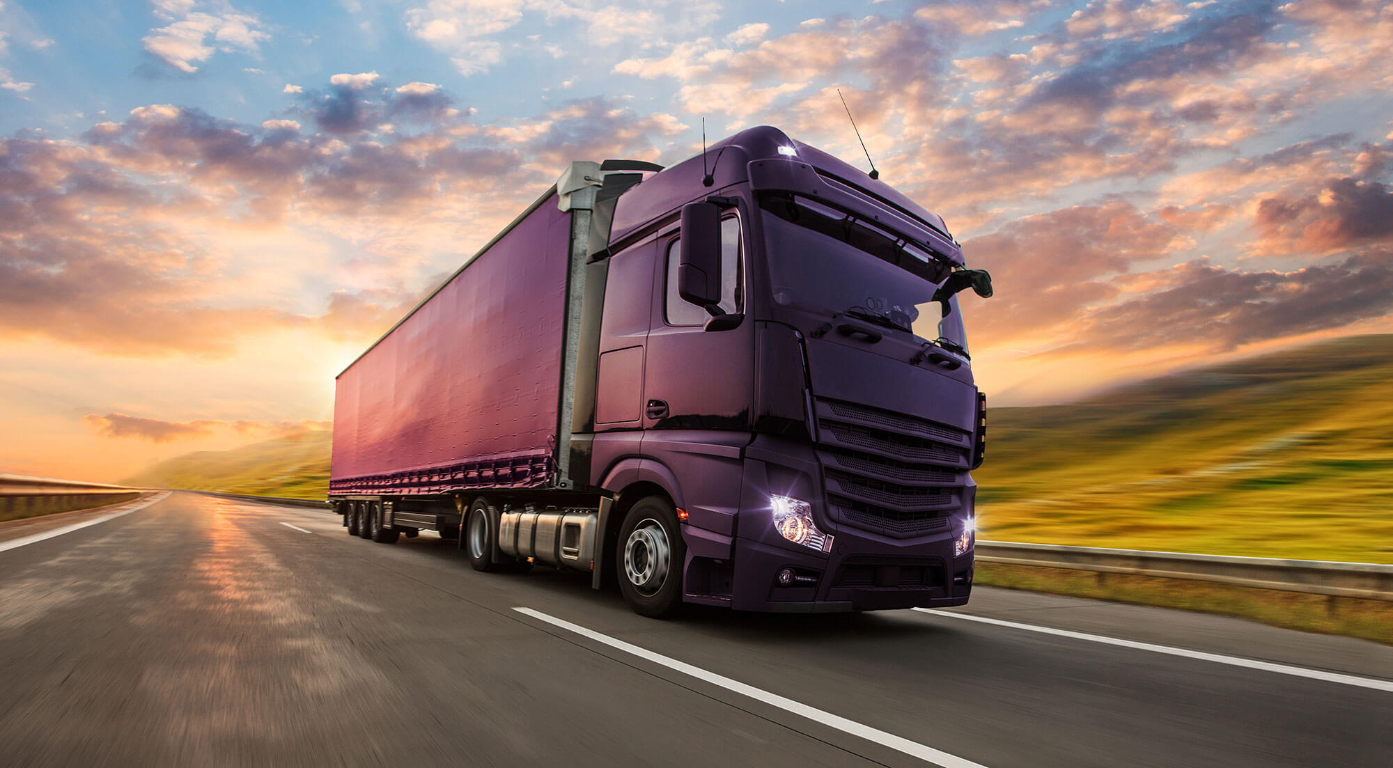 Our EDGE project client H&G branded lorry driving along a countryside road