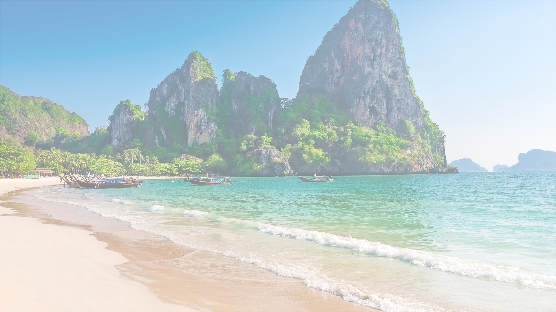 Honeymon dreams backgorund image of a white beach and mountain range