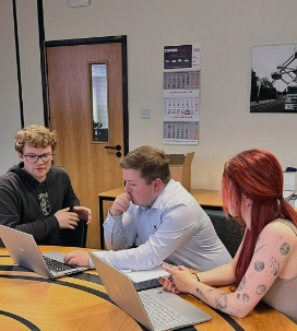 two people training a third in a email marketing masterclass