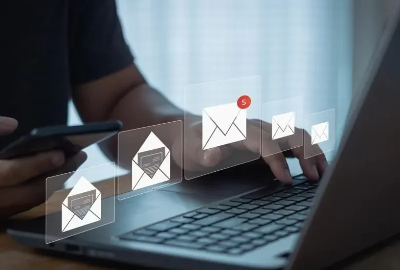 man typing on laptop