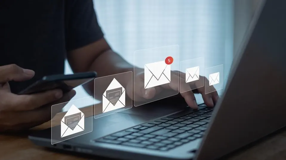 man typing on laptop